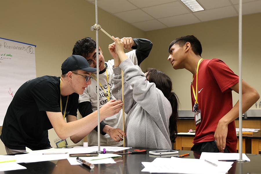 Students participate in a pendulum experiment in TIP engineering class
